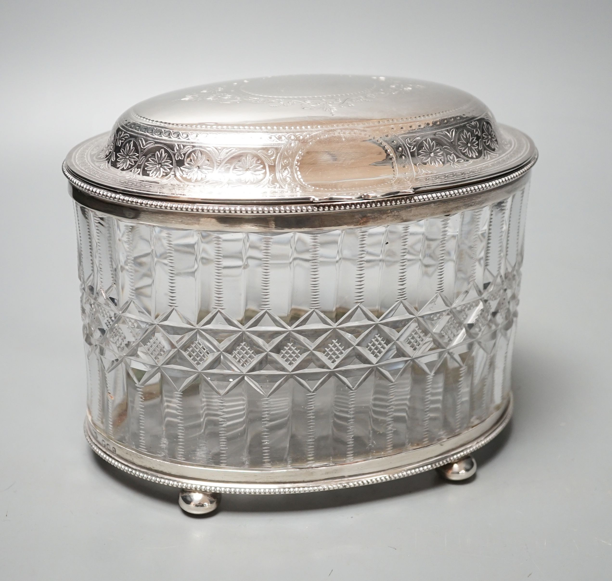 A Victorian engraved silver mounted cut glass oval biscuit barrel, double stamped maker's mark, London, 1874, height 15.5cm.